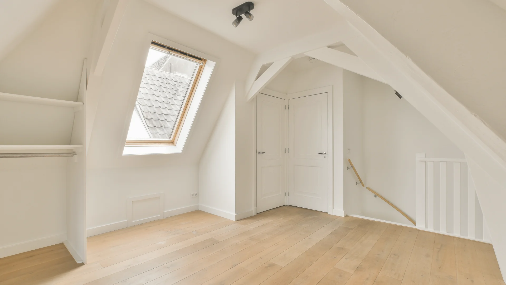 hipped roof attic after renovation painted in white